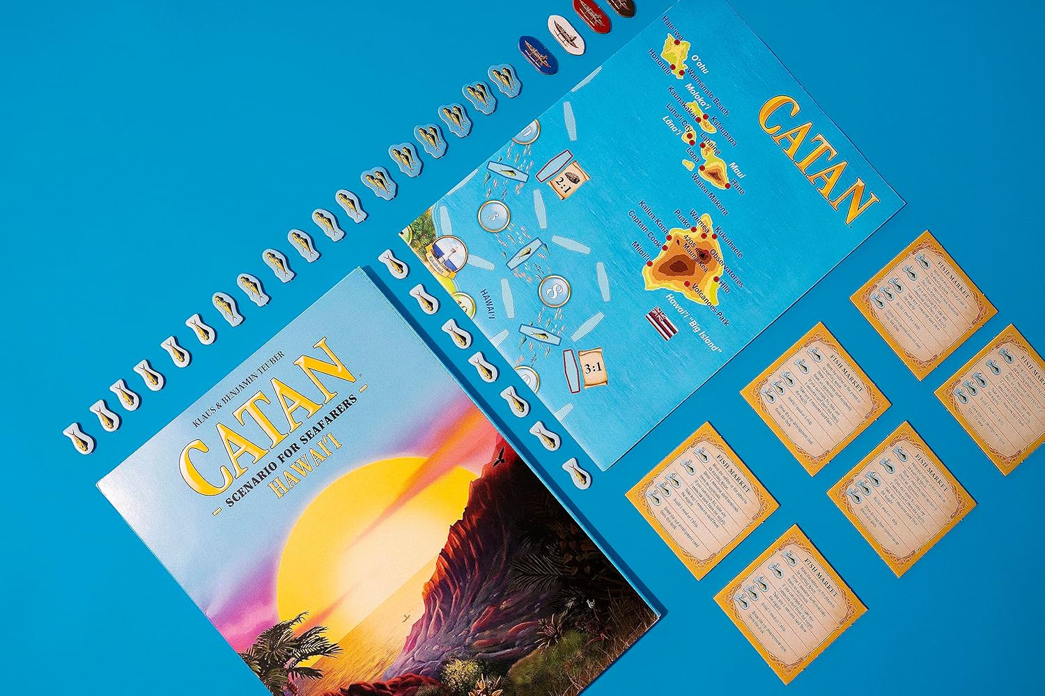 ボードゲーム CATAN Hawai'iシナリオ CATAN Seafarers拡張版 太平洋の楽園 熱帯の島々 戦略的開拓 漁業要素 魚トークン 漁船 魚市場カード ハワイ文化 歴史 英語表記 3-6人用 75分 10歳以上 ストラテジーゲーム